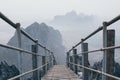 Mountain peak with empty stairs going down during sunrise foggy morning in Hpa-An, Myanmar Royalty Free Stock Photo