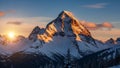 Mountain peak illuminated by the setting sun casting a warm glow Royalty Free Stock Photo