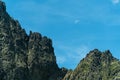 Mountain peak isolated on blue sky with moon