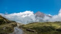 Mountain peak over clouds