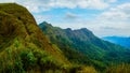 Mountain peak range landscape.  Green mountain range view. Mountain peak blue sky white clouds panorama Royalty Free Stock Photo