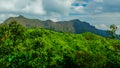 Mountain peak range landscape.  Green mountain range view. Mountain peak blue sky white clouds panorama Royalty Free Stock Photo