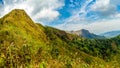 Mountain peak range landscape.  Green mountain range view. Mountain peak blue sky white clouds panorama Royalty Free Stock Photo