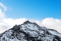 Mountain peak with snow and blue sky with white clouds in winter, winter landscape in Iceland Royalty Free Stock Photo