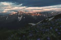 Mountain peak sunset landscape with gloomy dramatic mainly cloudy sky and orange and red sun beams Royalty Free Stock Photo