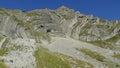 Mountain peak with visible geological layers in struggle