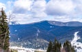 Mountain peaks of the Carpathian Mountains and ski slopes. Winter holidays in the mountains Royalty Free Stock Photo