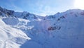 Mountain peaks covered with snow. Blue sky with light white clouds. Royalty Free Stock Photo