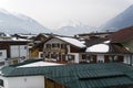 Mountain peaks in the haze over the roofs of houses. Royalty Free Stock Photo