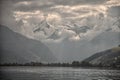Mountain peaks, puffy clouds and Zeller lake views from Zell am See, Austria Royalty Free Stock Photo