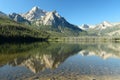 Mountain peaks reflecting in Redfish lake. Royalty Free Stock Photo