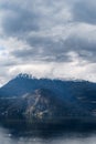 Mountain peaks with snow above the town of Menaggio. Lake Como, Italy Royalty Free Stock Photo