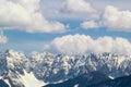 Mountain peaks snow and clouds background Royalty Free Stock Photo