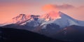 mountain peaks in the snow in the evening time Royalty Free Stock Photo