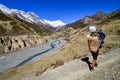 Mountain porter carrying heavy load