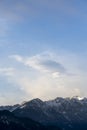 Mountain range around the Schwarzhanskarspitze mountain in vertical format in winter with gentle soft clouds
