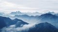 Mountain range with clouds and fog covering the peaks Royalty Free Stock Photo