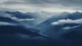 Mountain range with clouds and fog covering the peaks Royalty Free Stock Photo