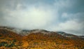 A mountain range covered in autumn foliage Royalty Free Stock Photo