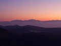 Mountain range covered in snow in dusk colors, Greece