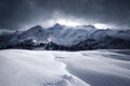 a mountain range covered in snow under a cloudy sky with clouds in the background and a few trees in the foreground Royalty Free Stock Photo