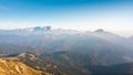 Mountain range horizon in the morning mist, and the rising sun