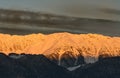 Mountain range lit by the rising sun