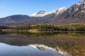 Mountain range with pine forest reflection on Pyramid Lake at Jasper national park Royalty Free Stock Photo