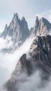 Mountain range shrouded in clouds under the sunny sky Royalty Free Stock Photo