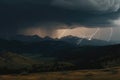 mountain range with a stormy sky, with lightning strikes and thunder Royalty Free Stock Photo