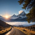 Mountain range with trail in mist and clouds, blue sky with sun in the backgroun...