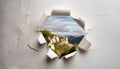 A mountain range is visible through a hole in a wall Royalty Free Stock Photo