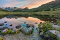 Mountain reflections at sunrise. Blea Tarn, Lake District, UK.