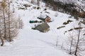 Mountain refuges in a snowy landscape Royalty Free Stock Photo