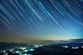 Mountain resort under star trails