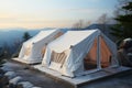 Mountain resorts winter allure with white camping tents for visitors