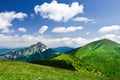 Mountain-ridge and blue sky with clouds