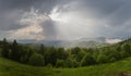 Mountain ridges in spring sunny evening after a rain, panorama Royalty Free Stock Photo