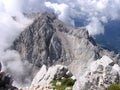 Mountain rising from clouds - Slovenian Alps Royalty Free Stock Photo