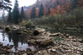 Mountain river in autumn time. Rocky shore. Colorful forest Royalty Free Stock Photo