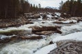 Mountain river on background of rocks and forest. Forest river water landscape. Wild river in mountain forrest panorama. Place for