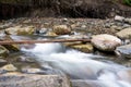 Mountain river with blured water close up Royalty Free Stock Photo