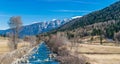 Panoramic view of Noce River surrounded by snow-capped mountains Italian Alps Dolomities Royalty Free Stock Photo