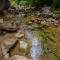 Mountain river with clean and fresh water in the rocks. Royalty Free Stock Photo