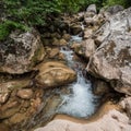 Mountain river with clean and fresh water in the rocks. Royalty Free Stock Photo