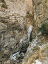 A mountain river flows through a high gorge