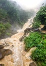 Landscape of mountain river got overflowed in the tropical jungle forest at mountains. Powerfull waterfall in mountains