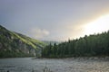 Mountain river landscape in Siberia - a stream of a mountain river. Dawn over the mountains. Oka Sayan River, East Saiyan, Russia Royalty Free Stock Photo