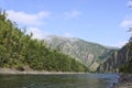 Mountain river landscape in Siberia - stream of a mountain river running between mountains in summer. River Oka Sayan, East Saiyan Royalty Free Stock Photo