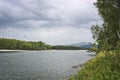 Mountain river landscape in Siberia - stream of a mountain river running between mountains in summer. Royalty Free Stock Photo